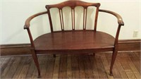 Delicate wood parlor bench, column look back,