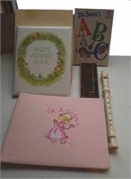 Baby books, musical recorder, wood abacus
