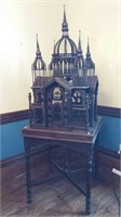 Temple bird cage on table with turets & tray