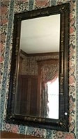Mirror with Ornate frame of dark veneer & gold