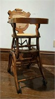 Antique oak high chair adapts  up & down
