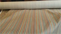 Bolt of striped upholstery material loose weave