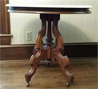 Oval marble top lamp table on casters
