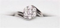 Sterling silver seven-diamond swirl style ring,