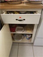 Drawer and cabinet full of kitchen supplies