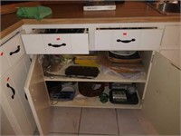 Cabinet and drawers full of kitchen supplies