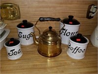 Black and white canister set with copper tea pot