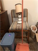 Chair, vacuum, waste baskets and lamp