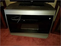 Silver T.V. Stand with Glass Front Doors