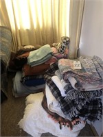 A very large lot of blankets and bedspreads