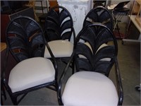 Four black patio chairs