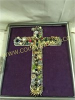 cross in frame crafted from jewelry gems