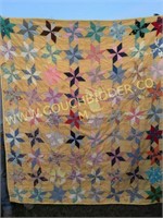 Pinwheel pattern yellow quilt