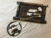 27B Rivers Edge coat rack and Saw blade artwork