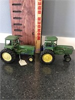 2 John Deere cab tractors