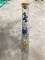 Tall bottle of marbles