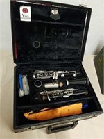 Older clarinet with accessories in case