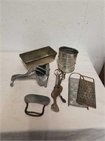 Vintage kitchen utensils includes graders, flour