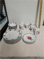 Group of collectible Coca-Cola plates, bowls and