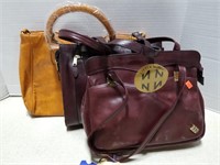 Three purse handbags