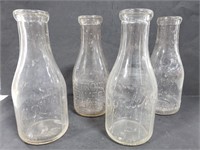 4 vintage glass milk jugs