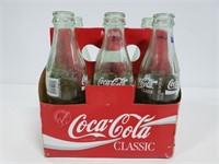 Glass Coca Cola bottles in carrier