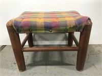 Plaid covered wood footstool