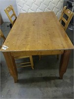 Country style kitchen table with three chairs