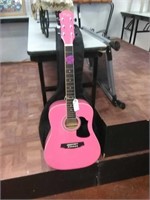 Pink guitar with case