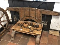 CARVED TIMBER AND IRON BUCKLE STOOL