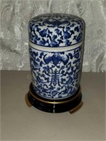 Lidded asian porcelain jar with stand