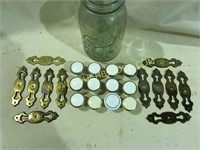 12 knobs with burnished brass backplates