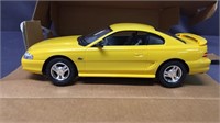 Ertl 1994 Ford Mustang canary yellow toy car