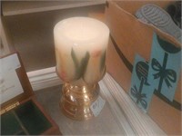 gold candle stand with candle
