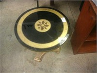 Gold and black circular side table