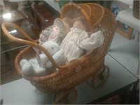 Wicker baby stroller with baby dolls