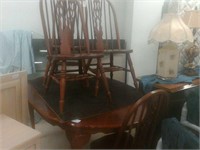 wooden dining table with four chairs