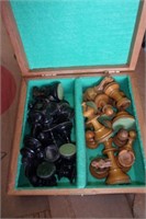 Wooden cigar box and chess pieces