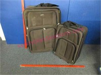 2 brown "prodigy" suitcases