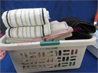 laundry basket with assortment of towels