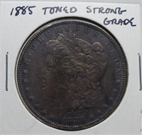 1885 TONED STRONG GRADE MORGAN SILVER DOLLAR