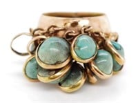 Egyptian gold ring set with green gemstones