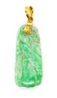 Oriental carved jade and gold pendant