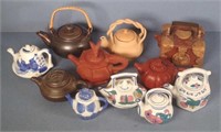 Eleven assorted Oriental teapots