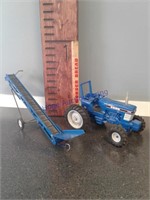 Elevator & Ford 7710 tractor