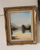 Oil on board of lake scene , gilt frame