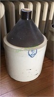 2 gallon stoneware jug with dark brown top, white