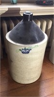 5 gallon stoneware jug with dark brown top, white