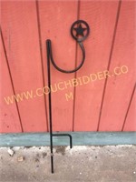 Heavy iron star garden hose holder