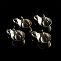 Four Danish Georg Jensen silver salts and spoons